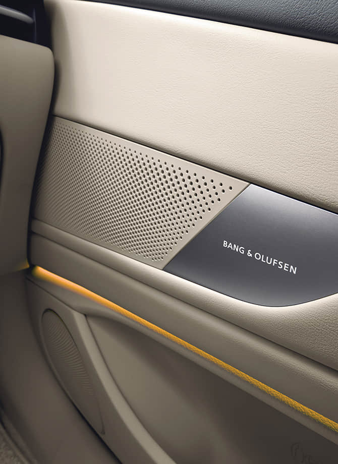 The Genesis steering wheel appears enlarged.