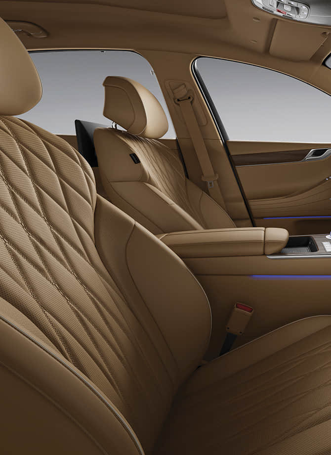 The Genesis steering wheel appears enlarged.