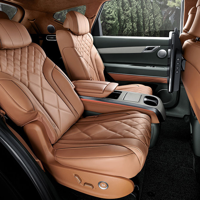 The Genesis steering wheel appears enlarged.