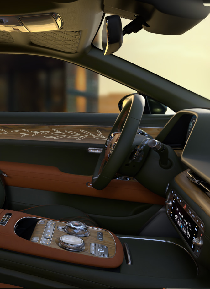 The Genesis steering wheel appears enlarged.